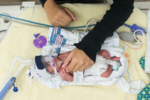 baby in a nicu bed